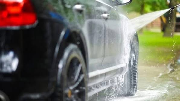 Foam cannon evenly applying soap on a car